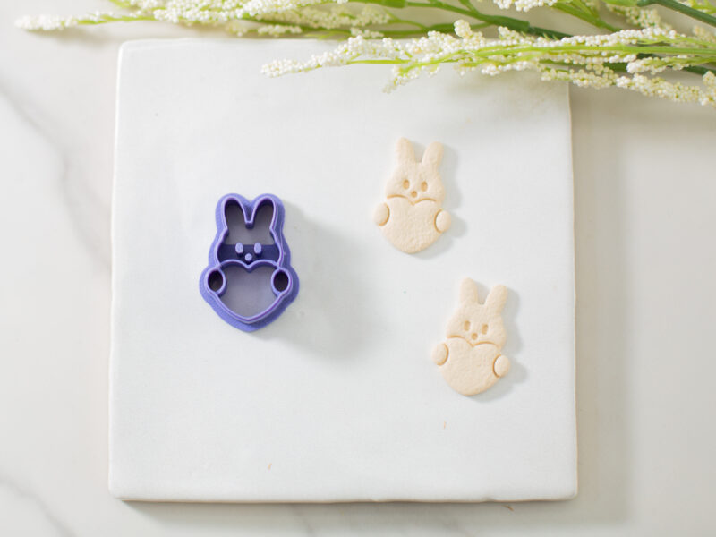 bunny holding a heart clay cutter