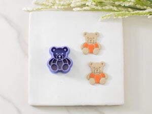 bear wearing a pumpkin clay cutter